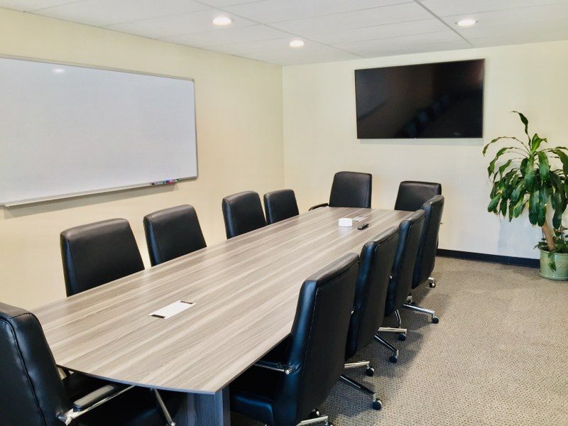10-seat conference room with TV and whiteboard at Zipdesk, Centennial
