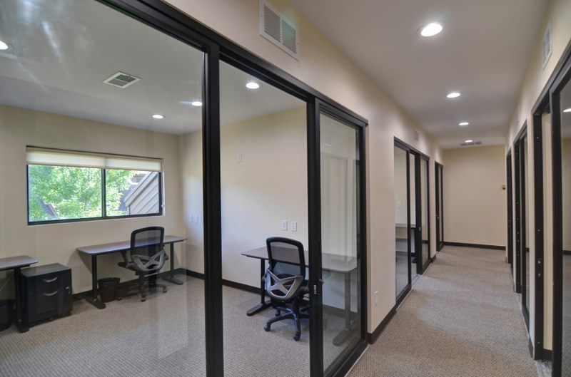 Glass-front private offices at Zipdesk