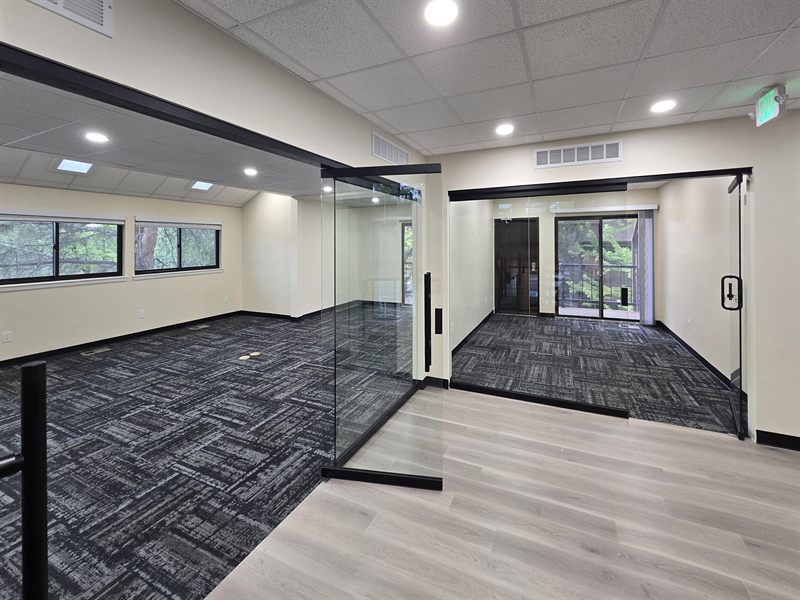Open work area and glass offices at Zipdesk